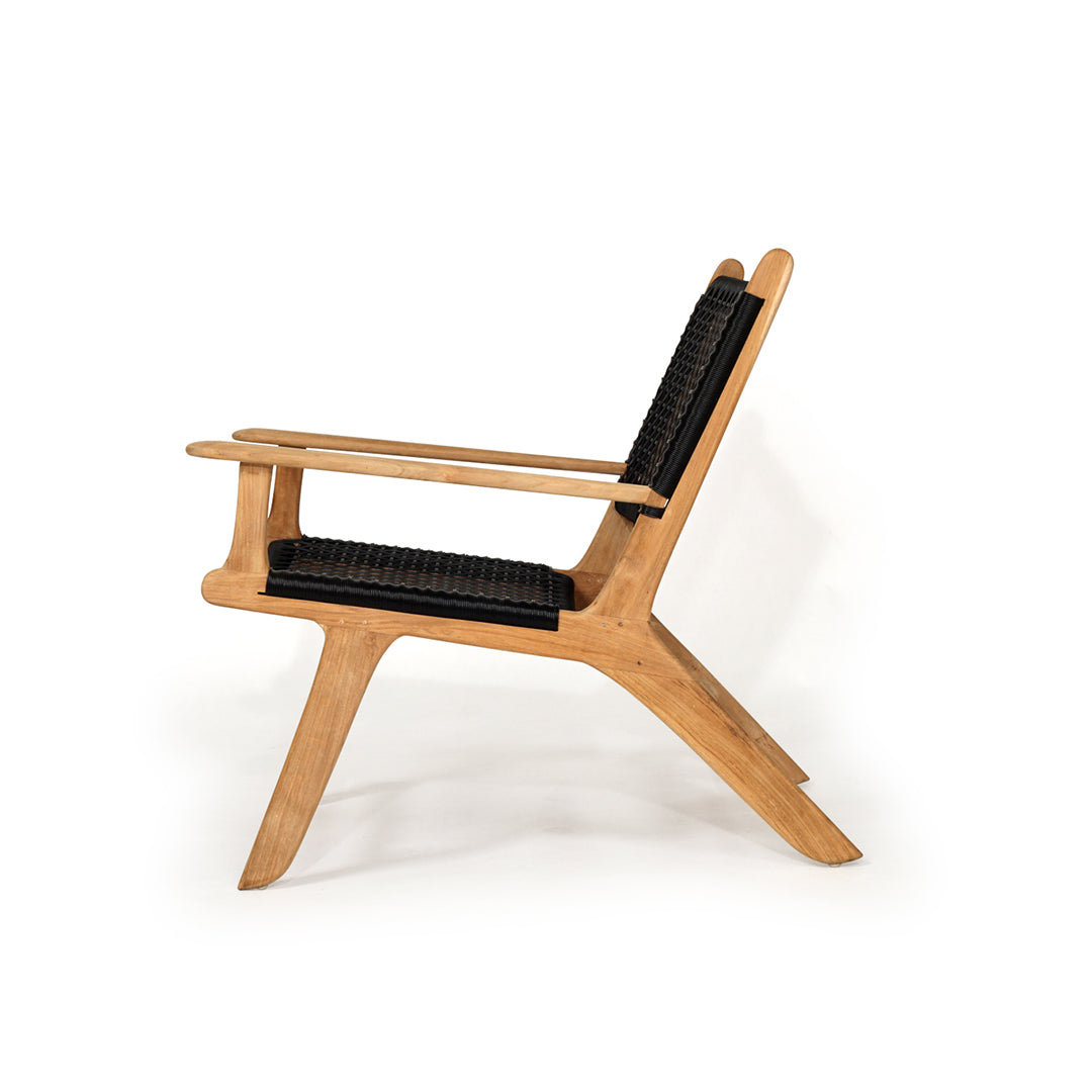 Side profile of Zen Lazy Chair in Black featuring ergonomic design, solid teak arms, and open rope weaving.