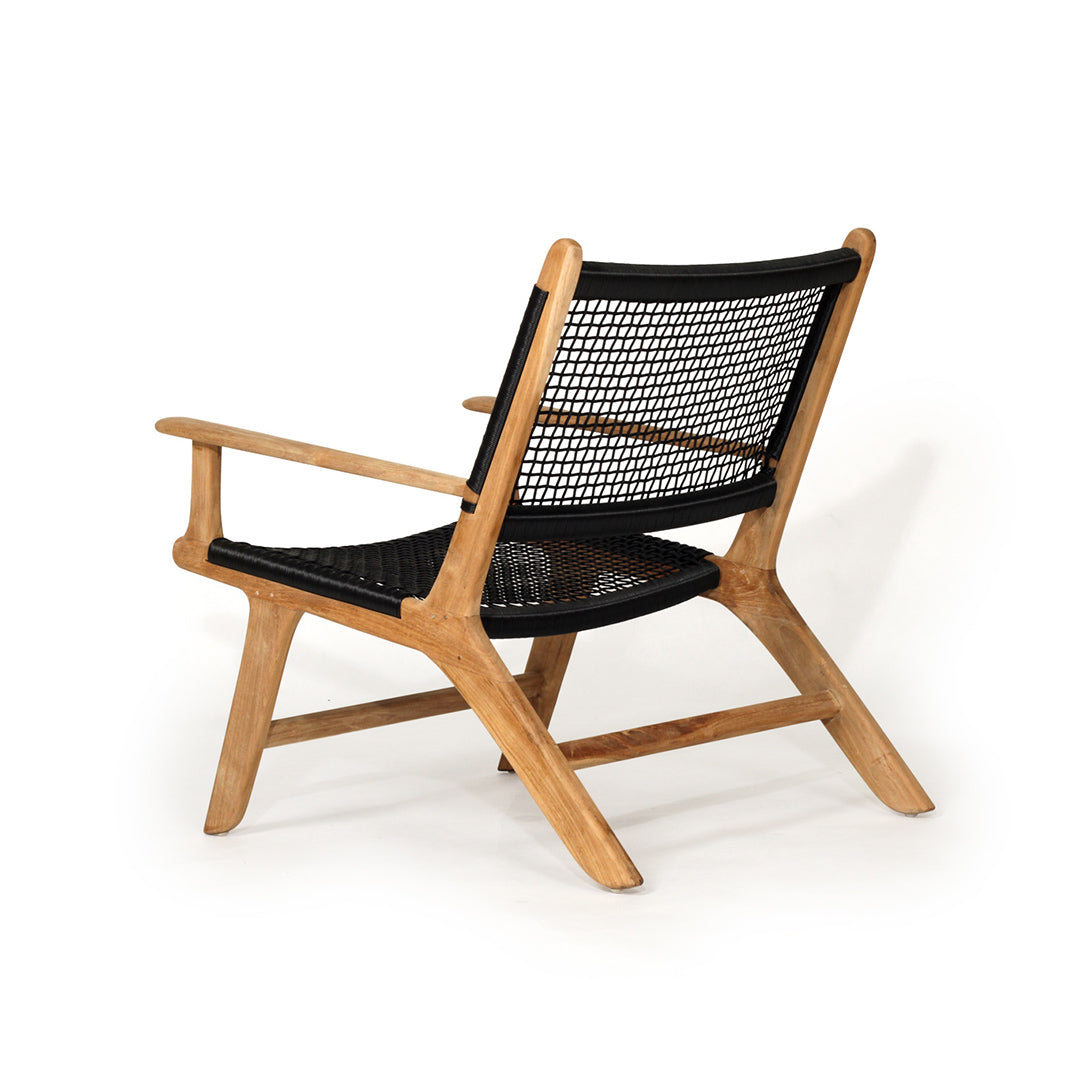 Angled back view of Zen Lazy Chair in Black with wide-set teak legs and open weave seat and backrest.