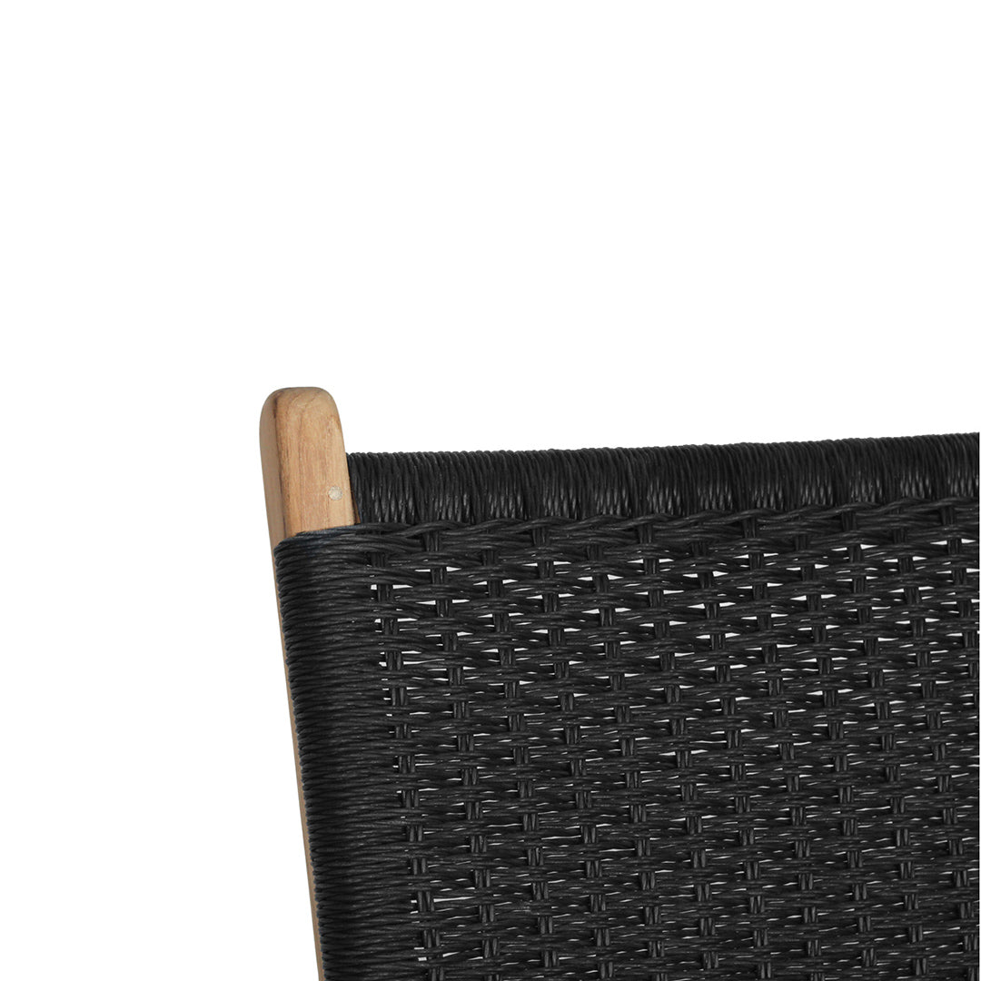 Detail view of upper backrest showing tightly woven black rope pattern and natural teak wood frame.