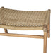 Close-up of the Zen Lazy Chair Ottoman - Sand - Close Weave, showcasing a tightly handwoven sand-colored rope seat in an intricate braided pattern, wrapped over a rounded corner of a solid teak wood frame.
