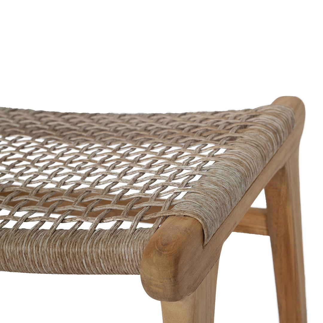 Close-up of the Zen Lazy Chair Ottoman in Washed Grey featuring an open weave seat made from handwoven tan cord, elegantly wrapped over a curved teak wood corner, showcasing its artisanal texture and organic tones.