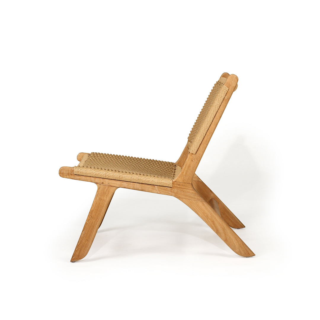Side profile of Zen Lazy Chair in Sand featuring sculptural teak base and ergonomic woven seat and backrest.