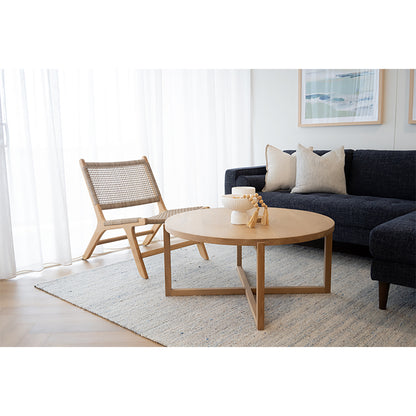 The Zen Lazy Chair – Washed Grey – Close Weave styled in a contemporary living room beside a navy sofa and natural oak coffee table. The pale teak frame and grey rope weave complement the neutral palette, ideal for coastal or Scandinavian-inspired interiors.