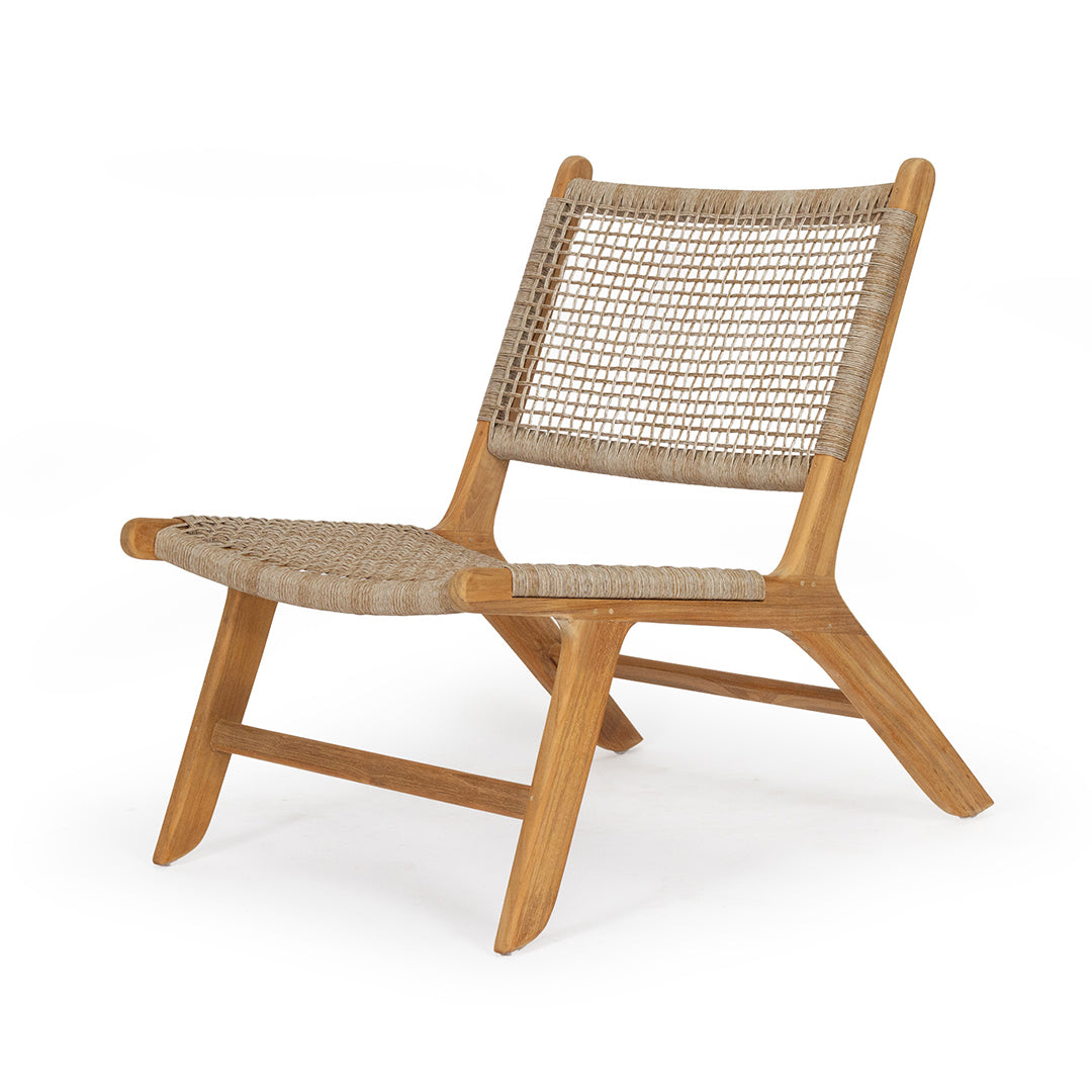 Three-quarter angle studio image of the Zen Lazy Chair – Washed Grey – Close Weave, showcasing its minimalist design with slanted legs, low profile, and softly textured seat. Pairs well with neutral palettes and natural textures.