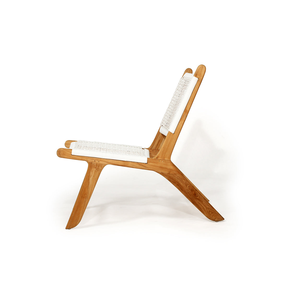 Side profile of the Zen Lazy Chair in White - Open Weave, showcasing its sleek, low-profile silhouette with a reclined backrest and curved teak legs, emphasizing the ergonomic and modern coastal design.