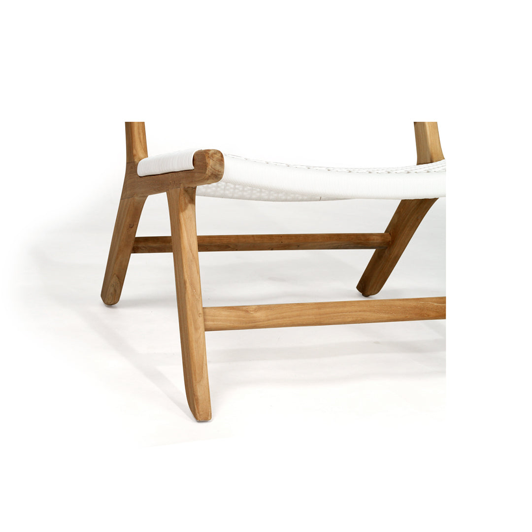 Close-up angled shot of the lower half of the Zen Lazy Chair - White - Open Weave, showcasing its contoured teak wood legs, crossbar support, and gently curved woven seat. The detail highlights the craftsmanship and ergonomic form of the chair.