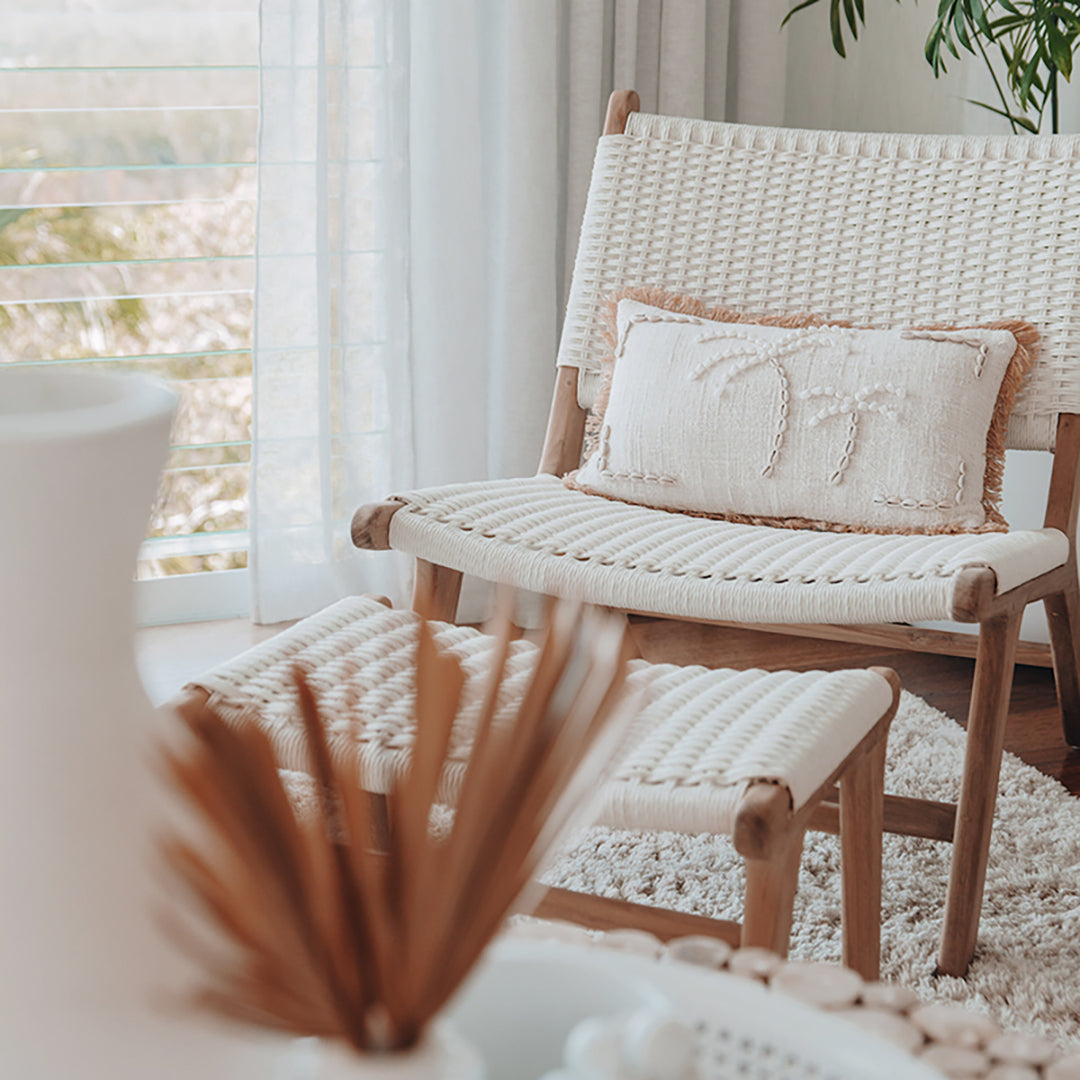 Zen Lazy Chair - White - Open Weave with coordinating ottoman, styled in a bright, neutral interior with a textured rug, embroidered cushion, and sheer curtains. The focus on comfort and airy design complements relaxed, coastal-inspired interiors.