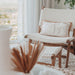 Zen Lazy Chair - White - Open Weave with coordinating ottoman, styled in a bright, neutral interior with a textured rug, embroidered cushion, and sheer curtains. The focus on comfort and airy design complements relaxed, coastal-inspired interiors.