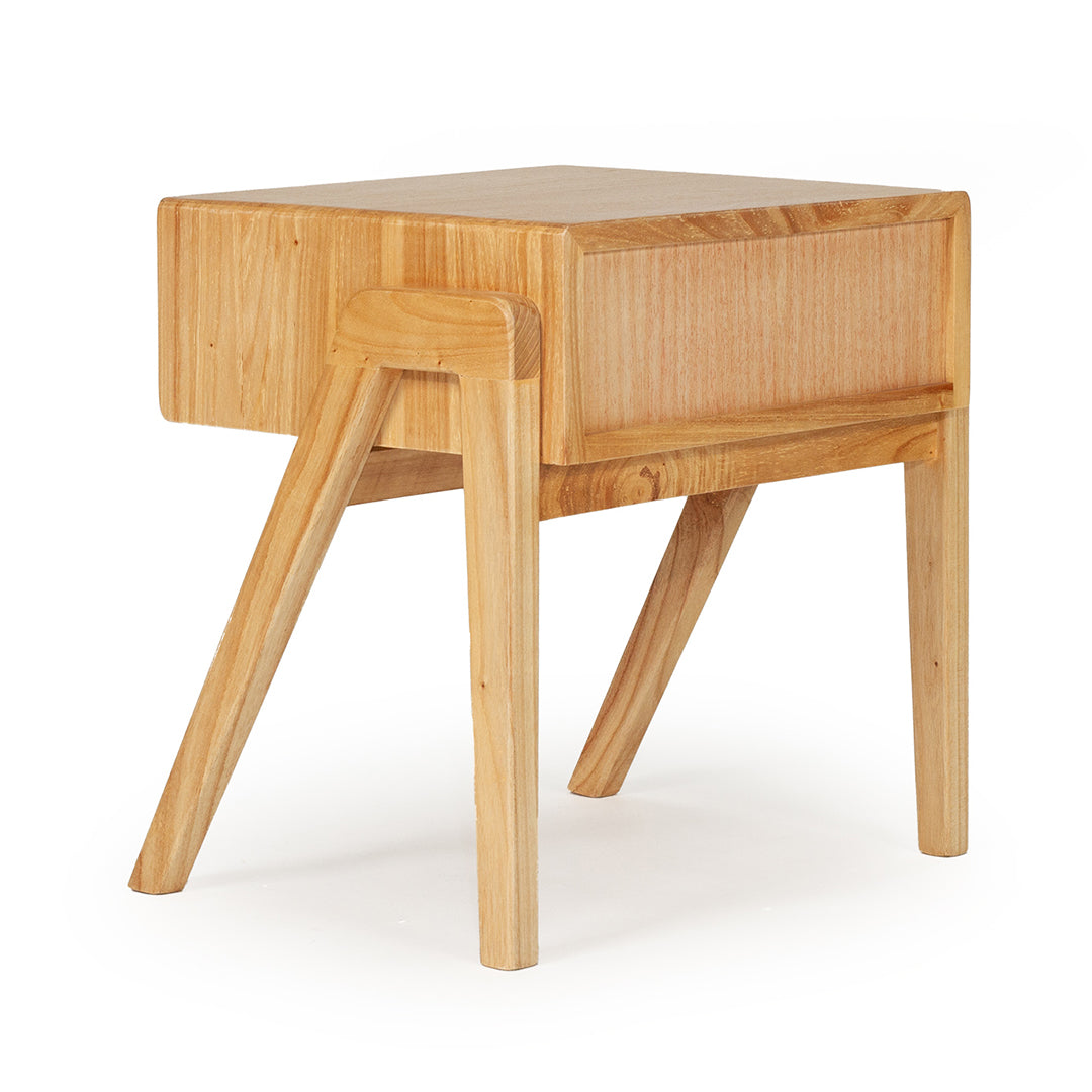 Back angled view of the Castaway Bedside Table with natural timber frame and rear leg detail