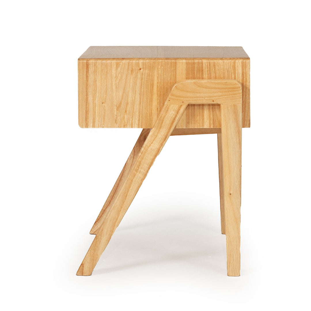 Side view of the Castaway Bedside Table showing natural timber construction and angled leg design