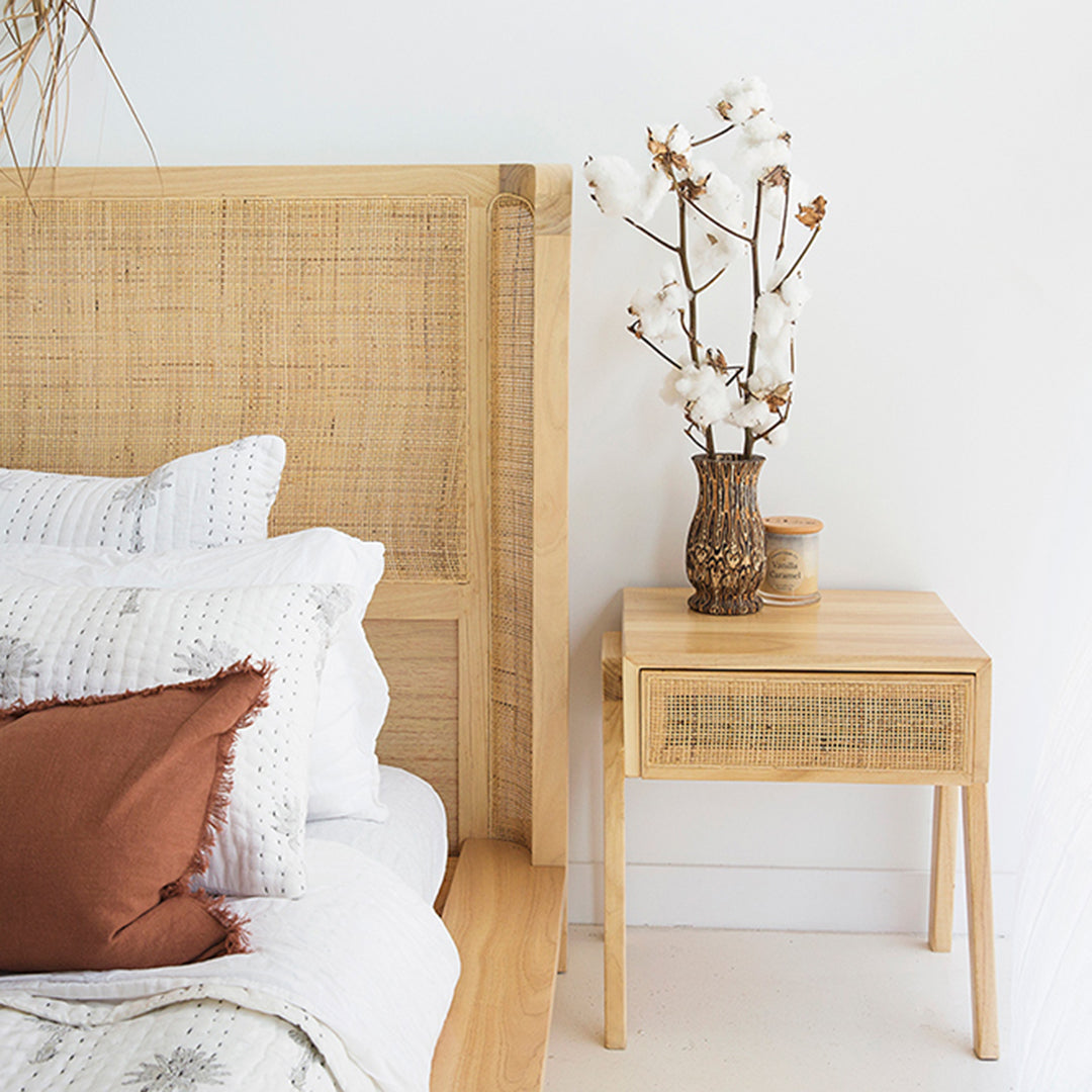 Castaway Bedside Table styled with Castaway Bed, natural timber frame and rattan headboard