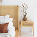 Castaway Bedside Table styled with Castaway Bed, natural timber frame and rattan headboard