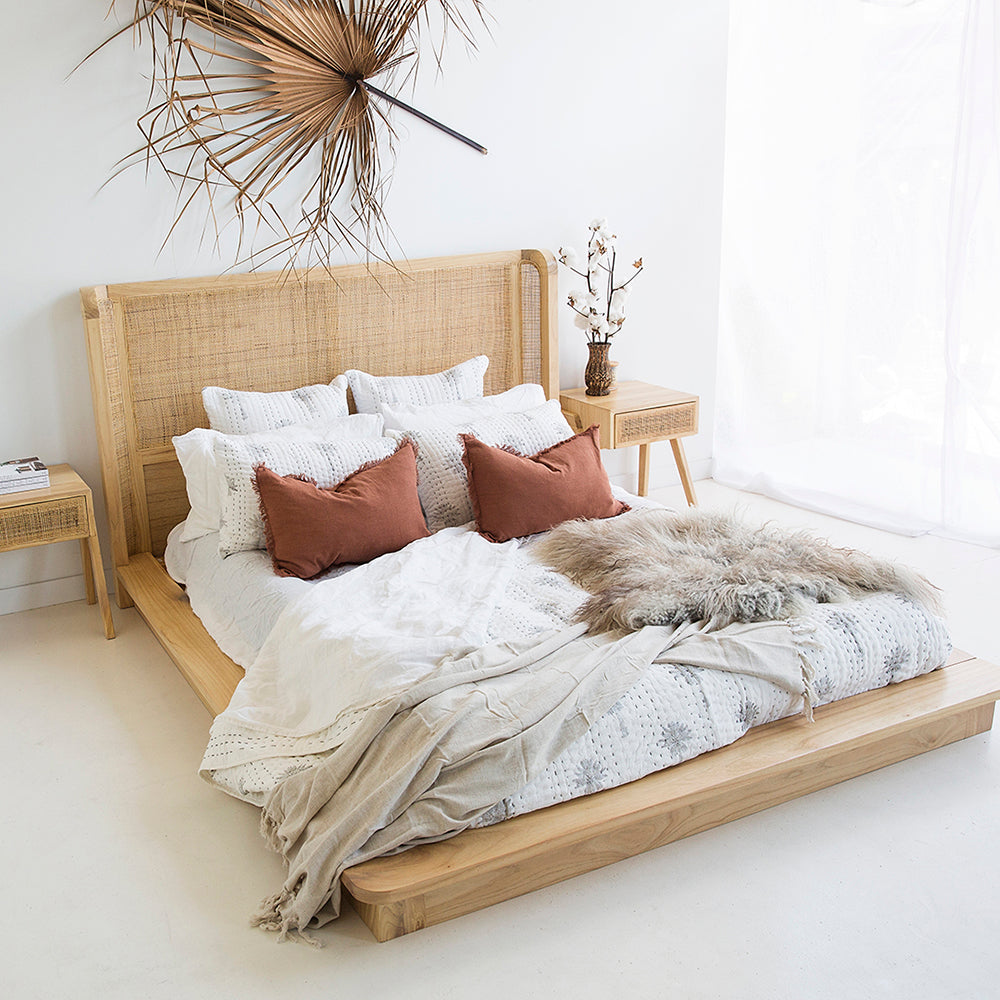 Castaway Super King Bed in natural timber with rattan headboard, platform base and matching bedside tables