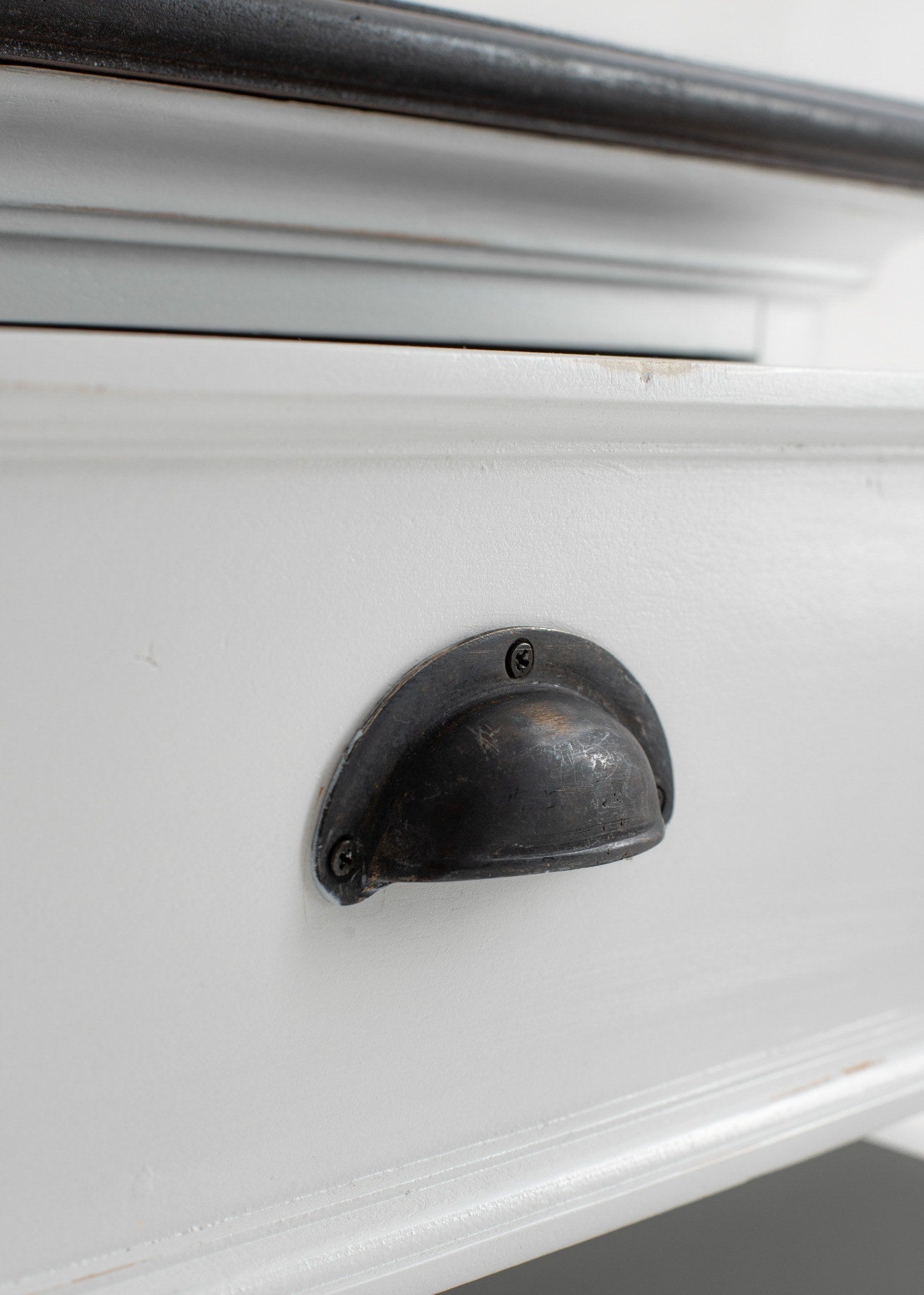 Close-up of Halifax Accent bedside drawer unit antique cup pull handle on white drawer
