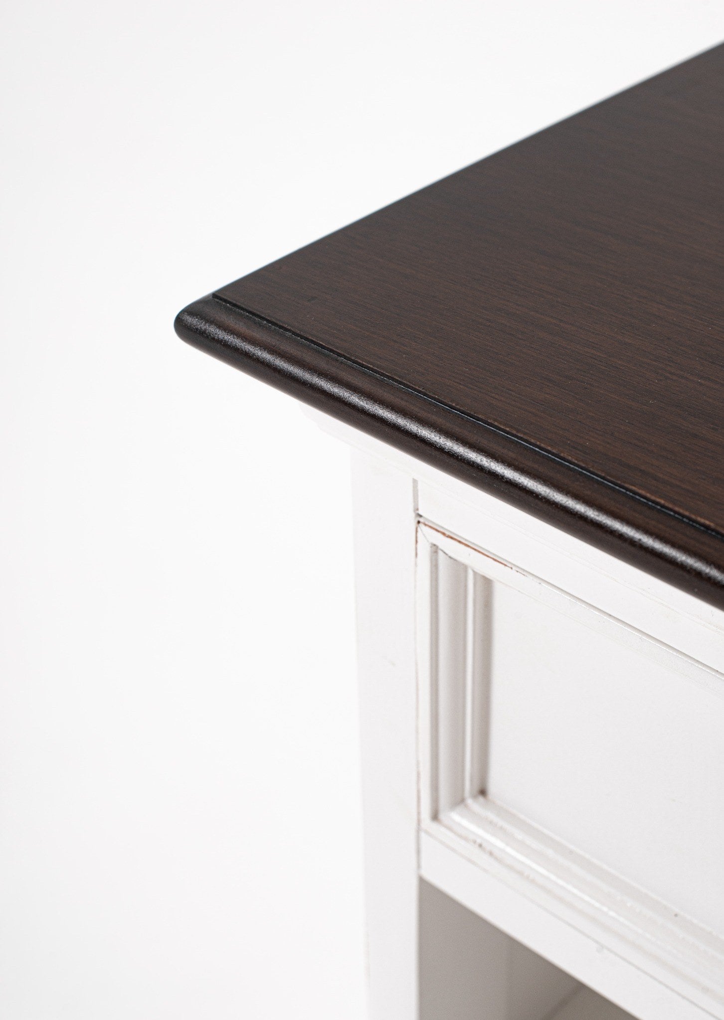 Close-up of Halifax Accent bedside table dark timber top edge and white panel detail