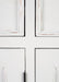Halifax Accent Buffet close-up of distressed white painted cabinet doors with moulded panel detail and vintage coastal finish.