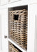 Halifax Accent Buffet with 2 baskets close-up of natural woven rattan basket in centre storage cubby with white painted sideboard surround.