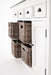 Halifax Accent Buffet with 4 baskets angled detail showing woven rattan basket storage, white painted cabinet doors and antique black drawer handles.