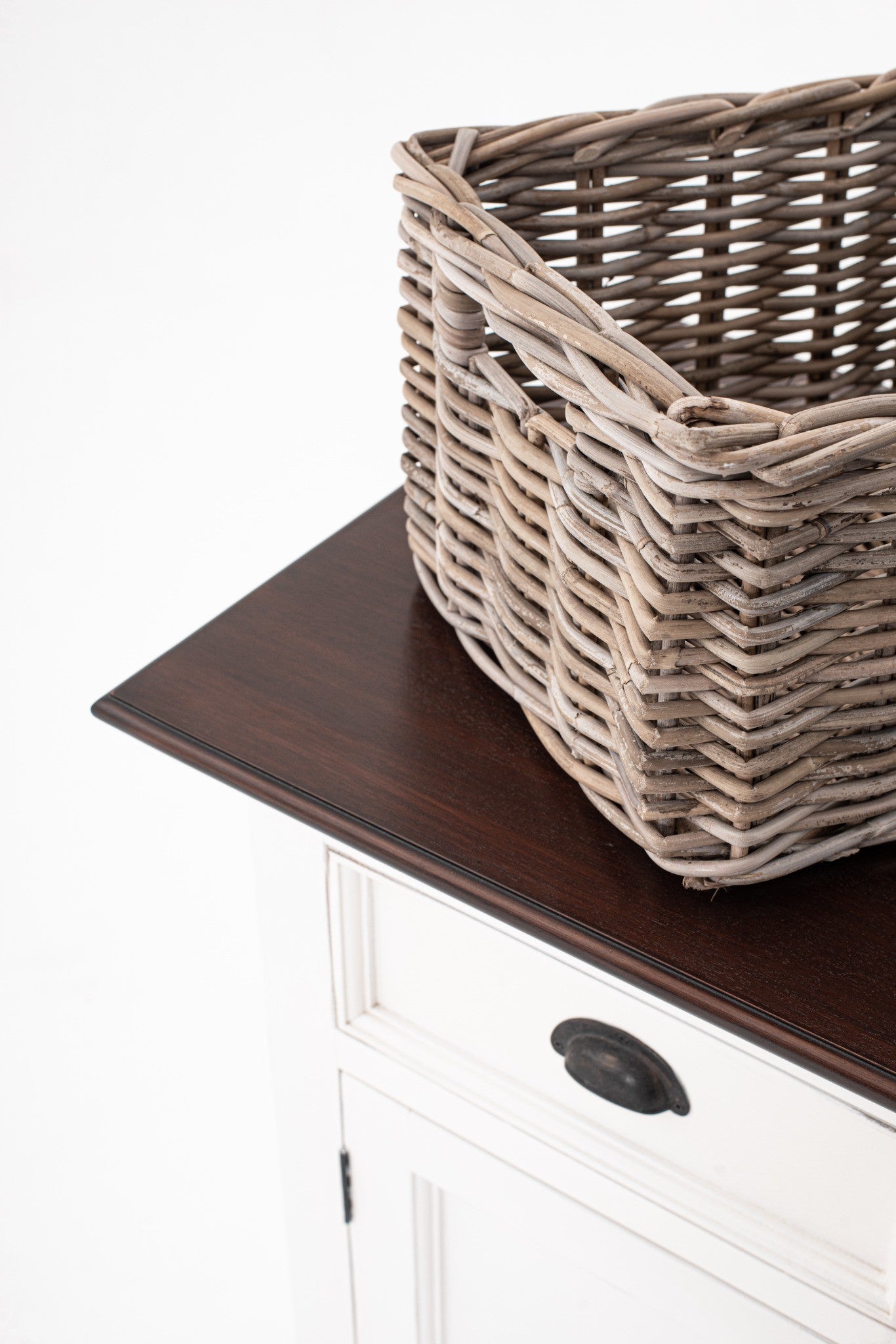 Halifax Accent Buffet with 4 baskets close-up of woven rattan basket on dark timber top, showing natural texture and coastal storage detail.
