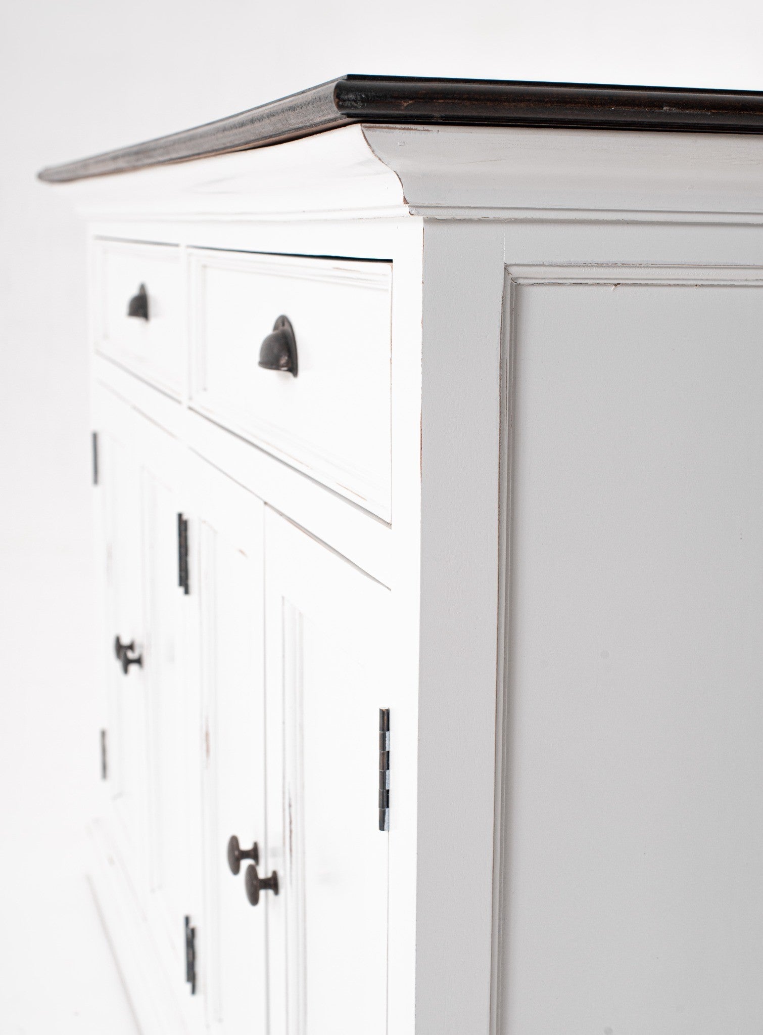 Halifax Accent Classic Buffet side detail showing white painted panel, drawer front, antique black cup handle and dark timber top edge.