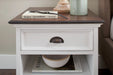 Close-up of Halifax Accent white bedside table drawer with dark timber top and antique cup pull