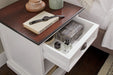 Halifax Accent white bedside table with open drawer, bedroom storage detail and dark timber top