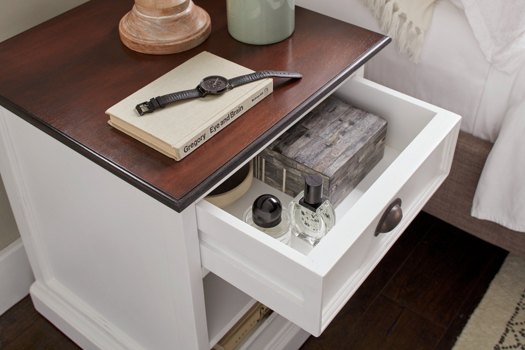 Halifax Accent white bedside table with open drawer, bedroom storage detail and dark timber top