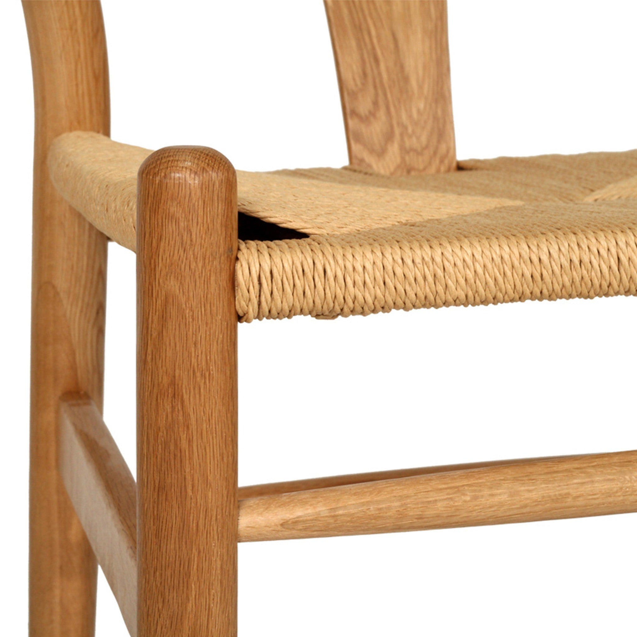 Wishbone Counter Stool in Natural Oak close up of the woven cord seat corner and rounded natural oak leg.