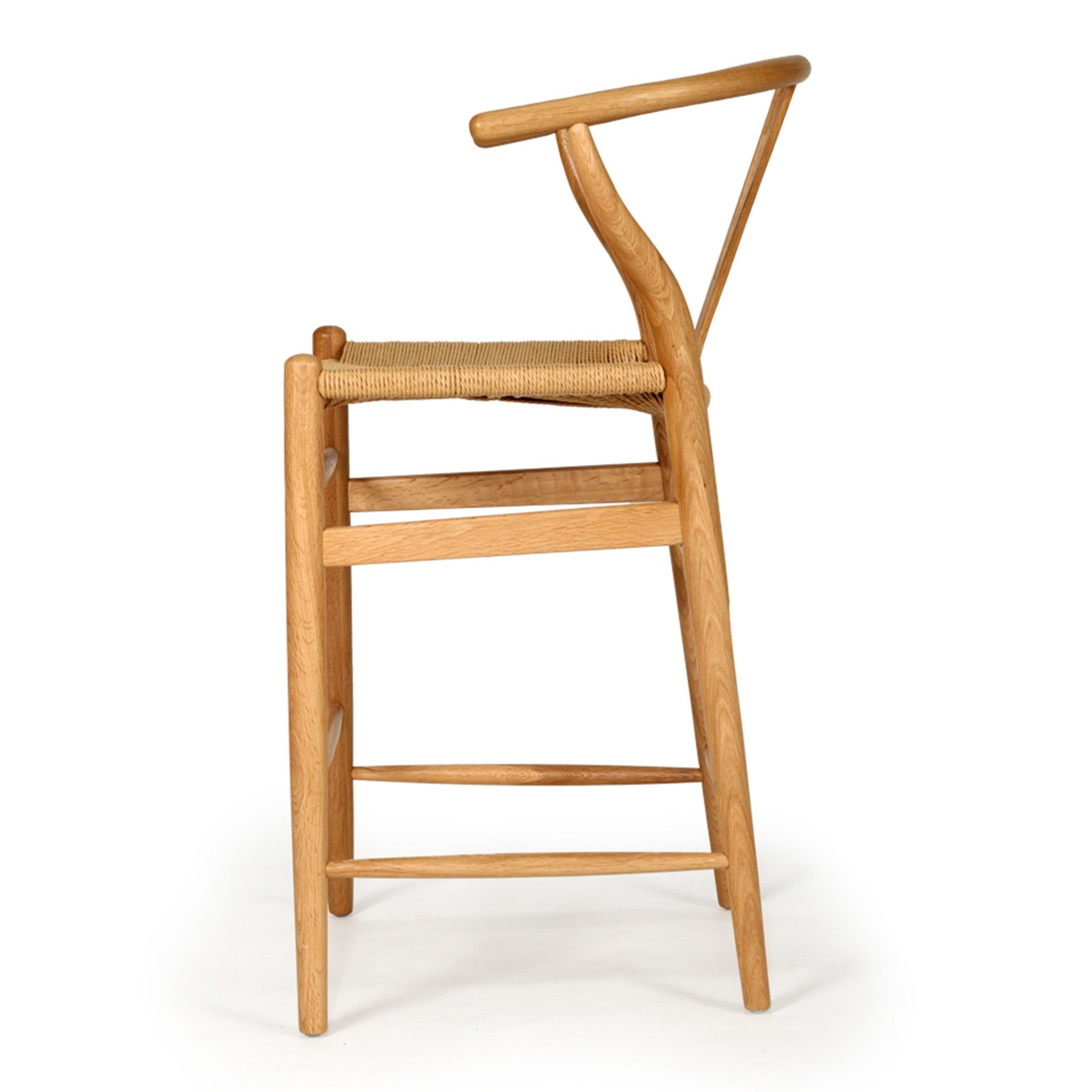 Wishbone Counter Stool in Natural Oak profile view showing the tall timber frame, curved backrest and woven cord seat.