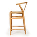 Wishbone Counter Stool in Natural Oak profile view showing the tall timber frame, curved backrest and woven cord seat.